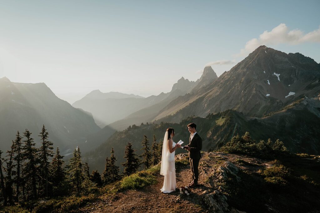 Bride reads vows to groom during their elopement in the North Cascades