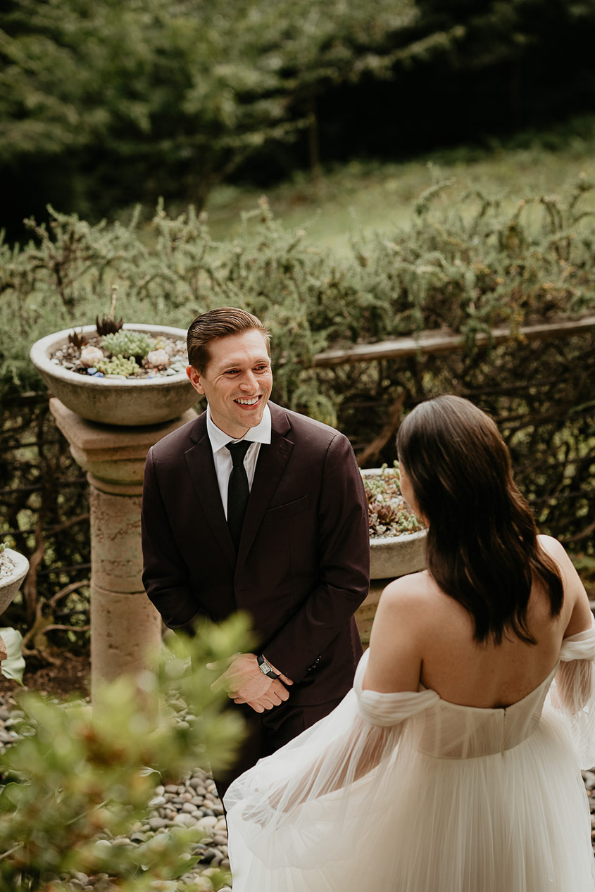 A couple right after their first look, with the soon-to-be husband turns around. 