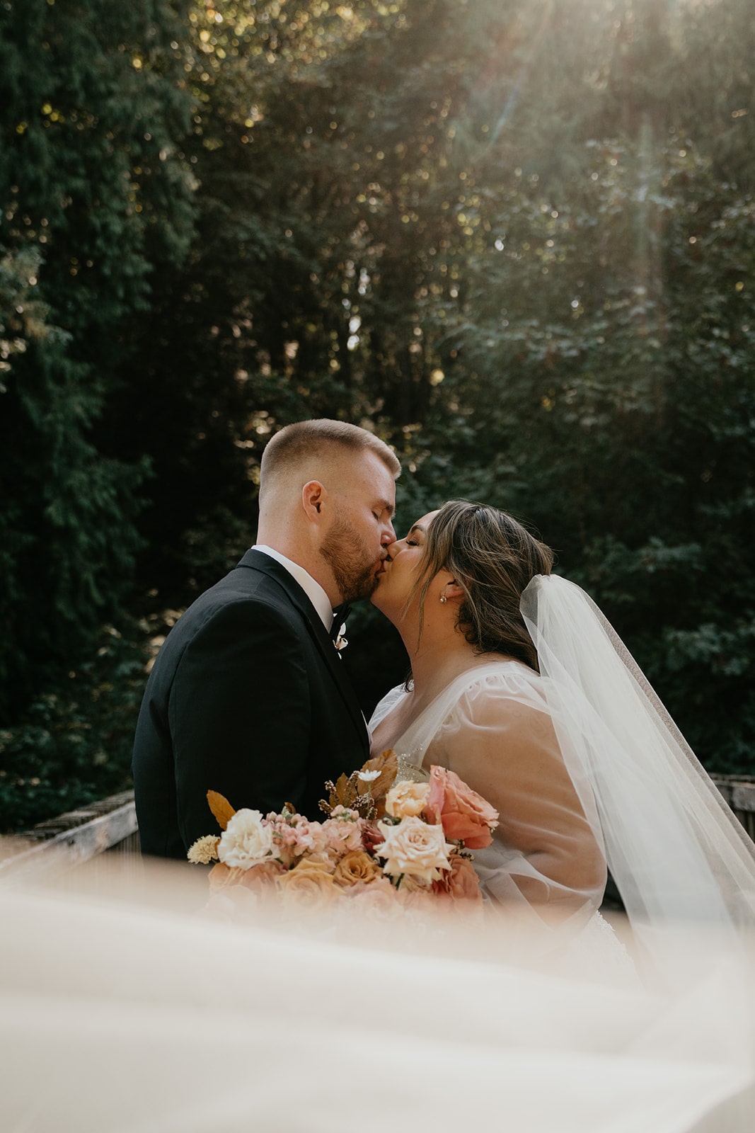 Bride and groom kiss during their Ironlight Lake Oswego wedding photos 