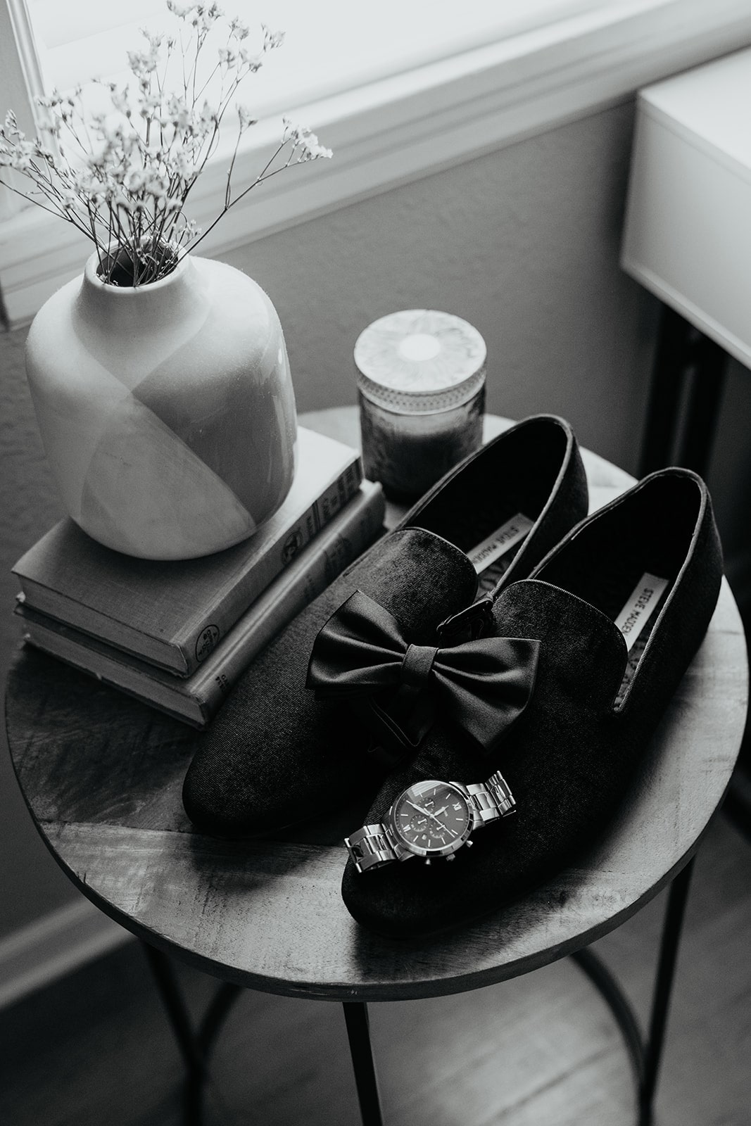 Black velvet loafers and watch