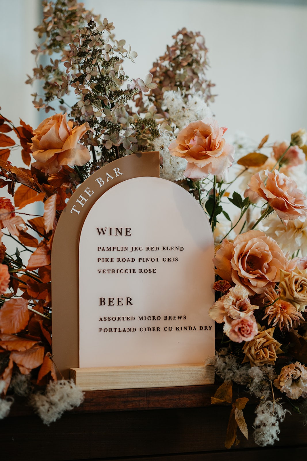 Brown and beige custom bar signage at a Lake Oswego wedding at Ironlight venue