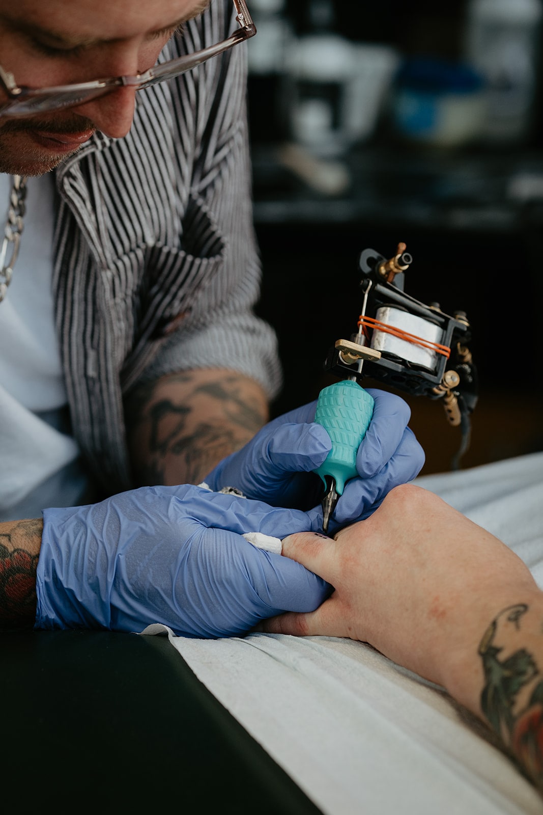 Bride gets tattooed at her Ironlight wedding reception in Oregon