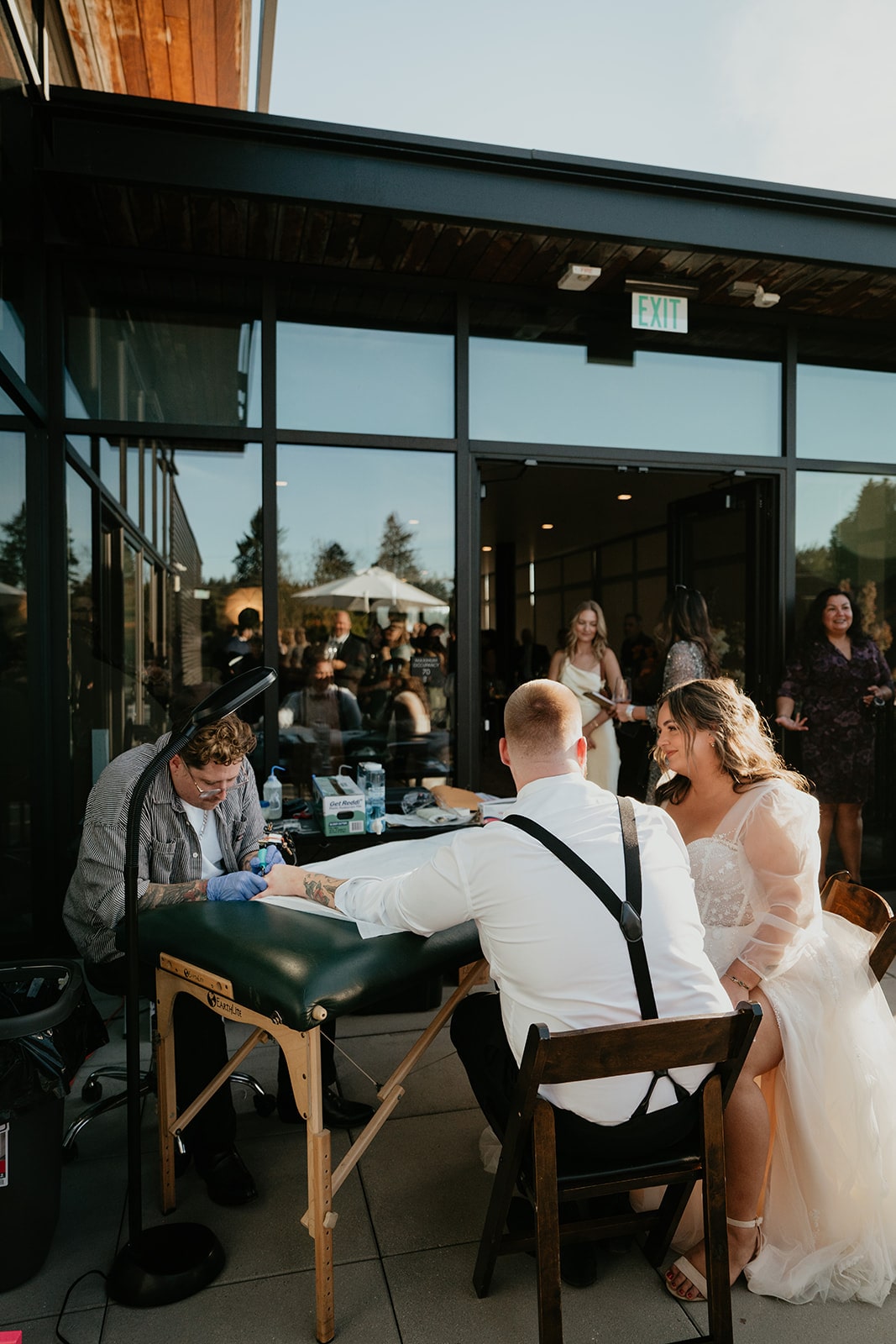 Groom gets tattooed at his Ironlight wedding in Lake Oswego, Oregon