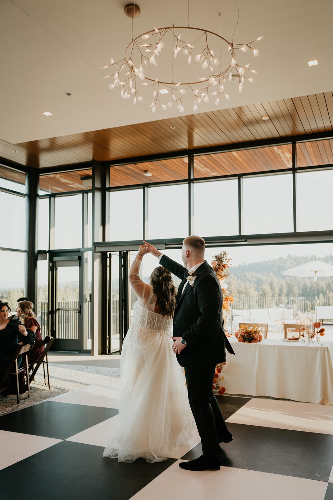 Bride and groom share a first dance at their Ironlight wedding in Lake Oswego, Oregon