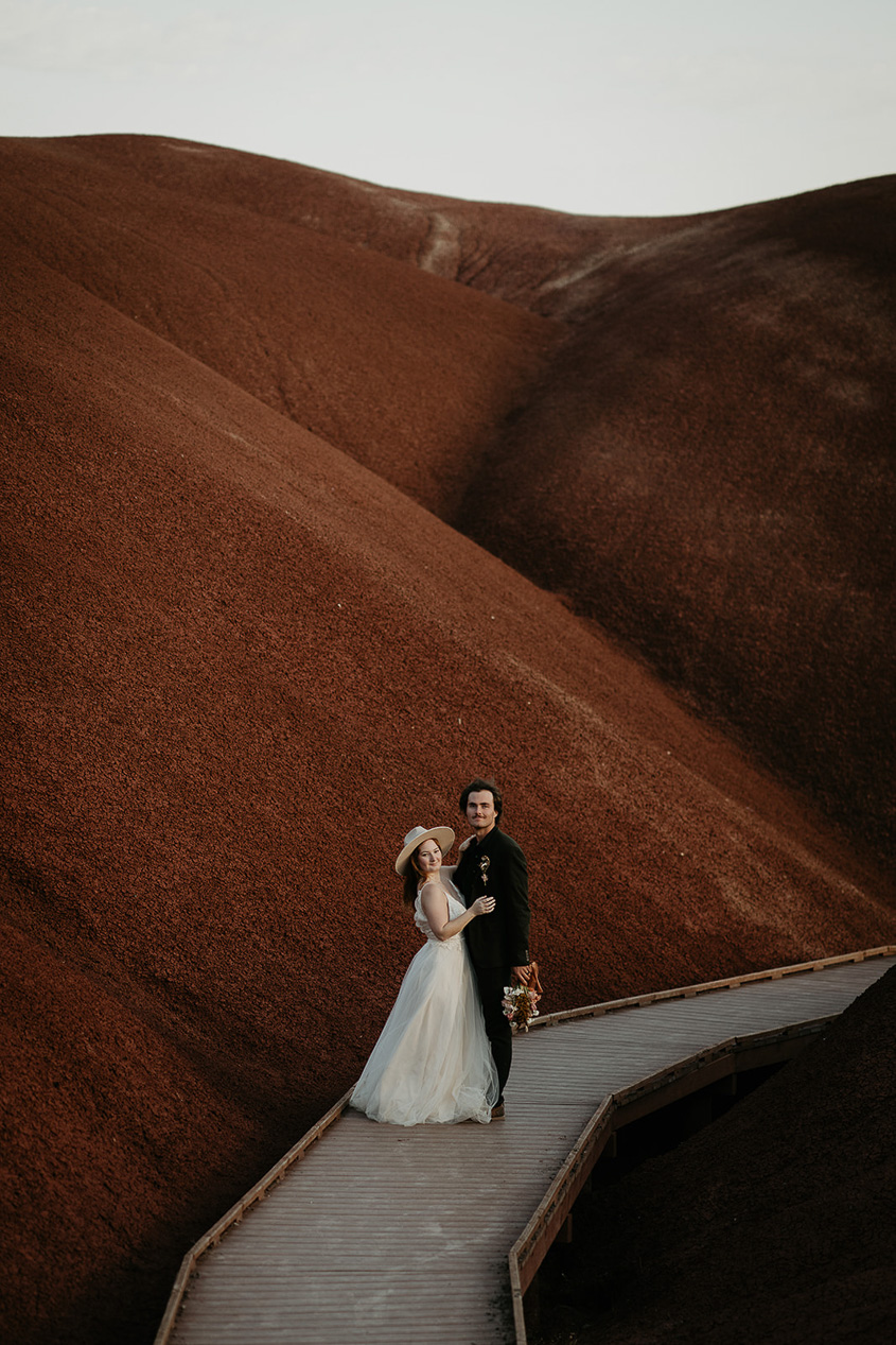 newlyweds enjoying painted rocks in Oregon.