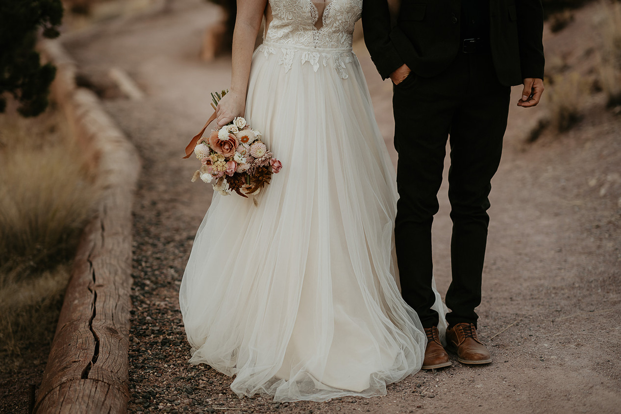 the bride's dress and groom's pants on an Oregon trail.