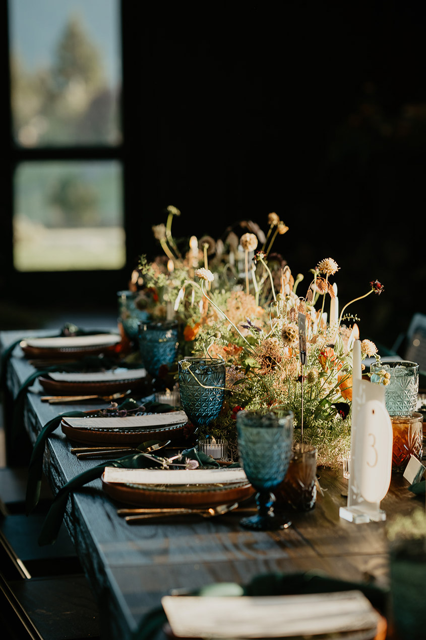 plates, cups, plants, and other table settings.