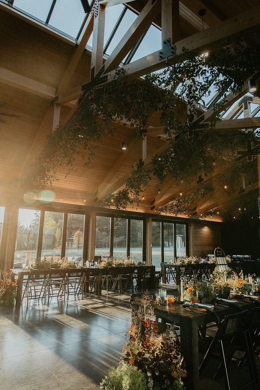 the sun poking through the window and into the wind mountain ranch wedding reception area.
