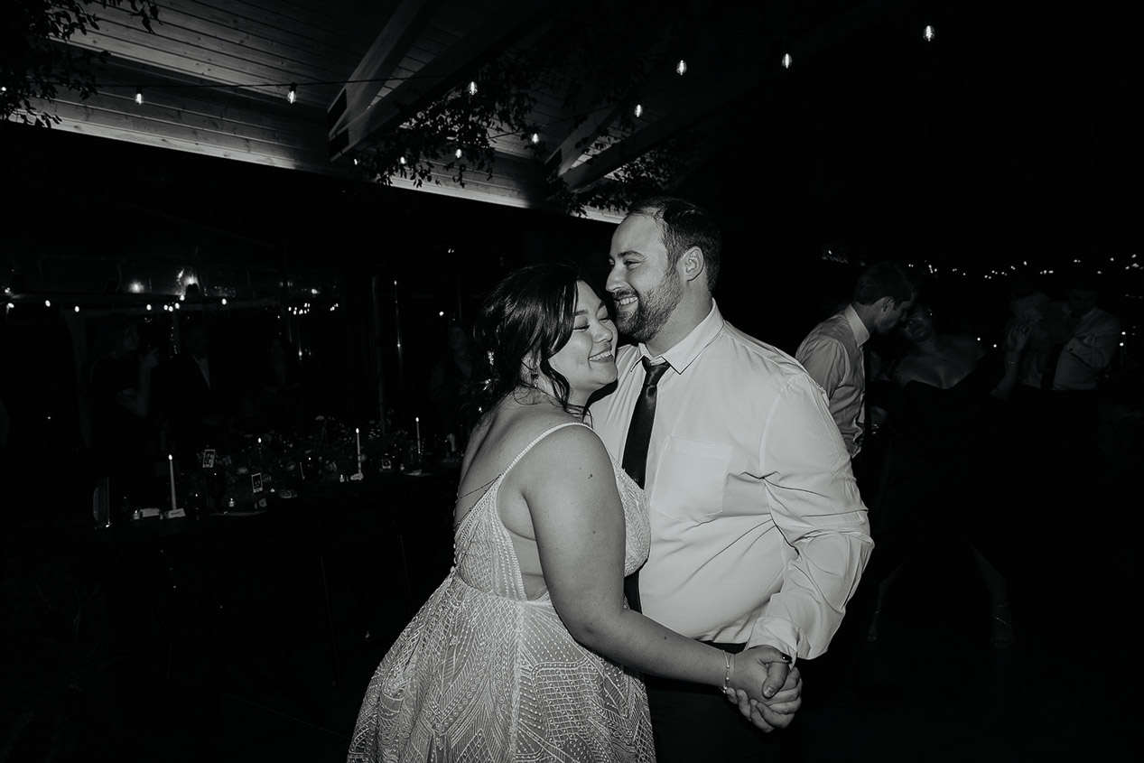 the newlyweds partying and dancing during their wind mountain ranch wedding.
