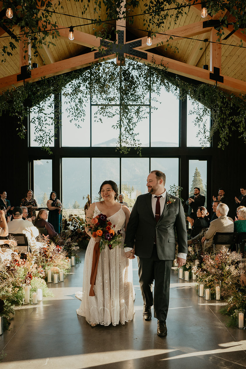 the newlyweds walking down the isle.