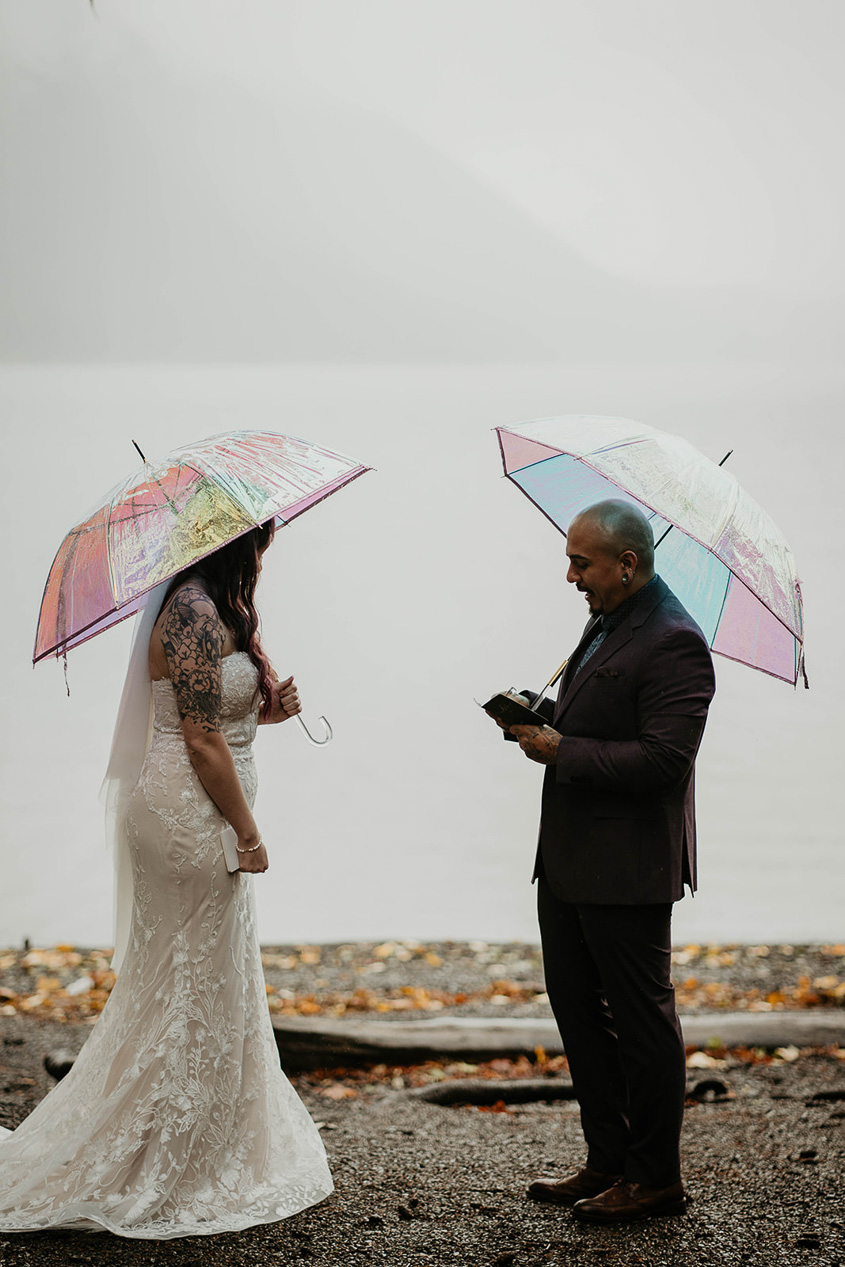 a couple exchanging vows during their moody lake crescent elopement ceremony.