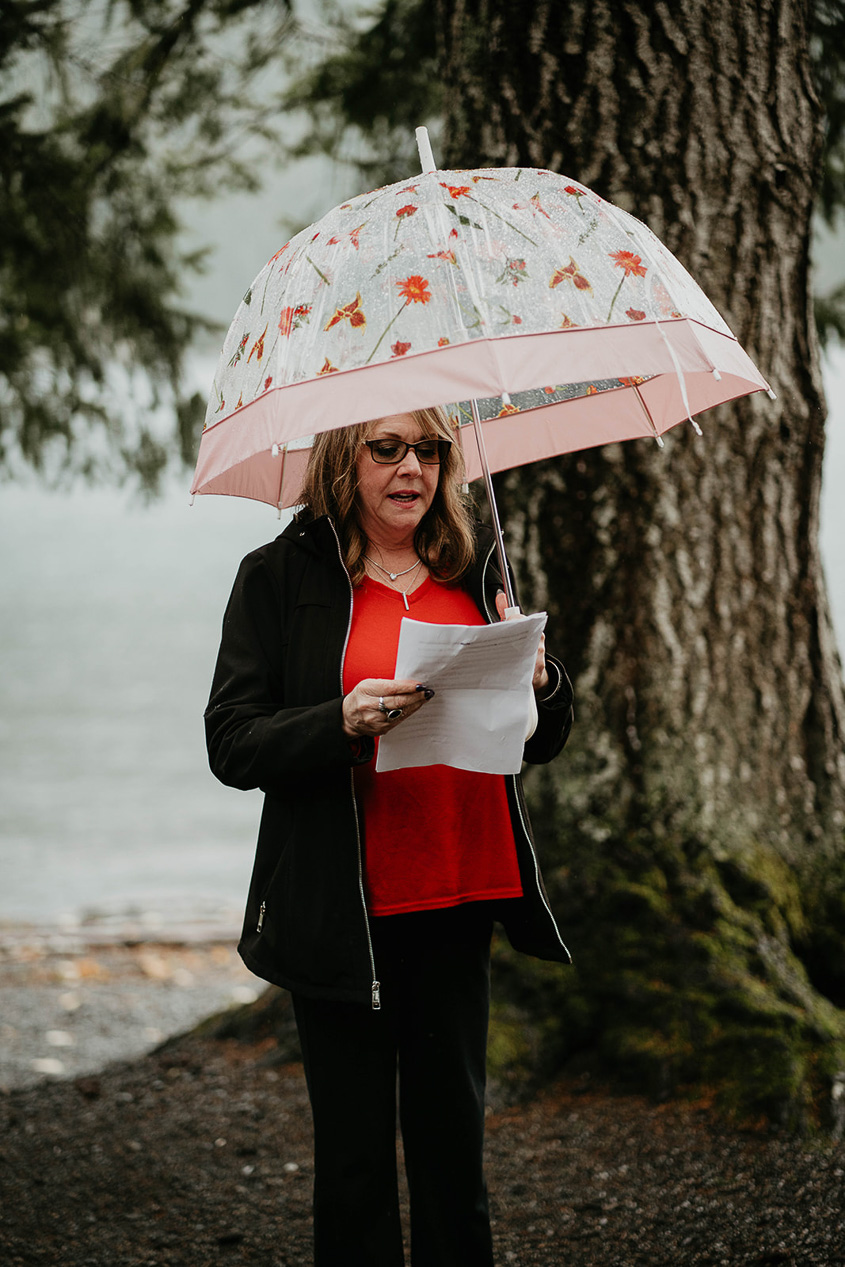 the couple's mom officiating their elopement ceremony at lake crescent.