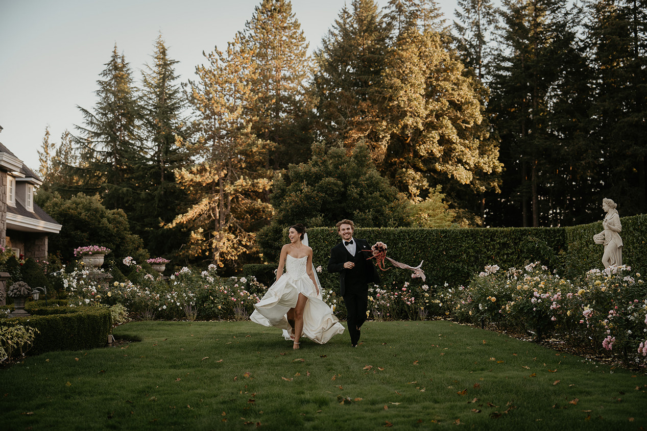 newlyweds running through a rose garden during their Chateau de Michellia wedding.