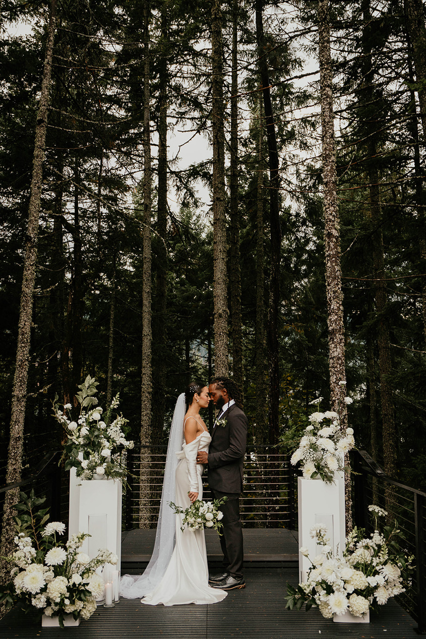 a couple embracing each other on a floating wedding ceremony deck at rocky hill events.