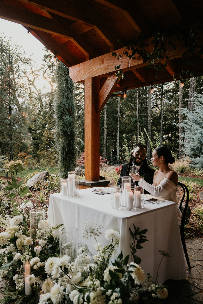 a couple eating a meal under a pavilion at rocky hill events, one of the best columbia river gorge wedding venues.