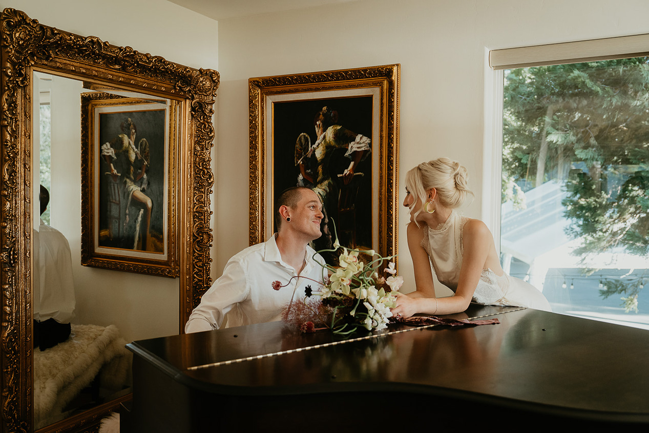 newlyweds hanging out at the piano at The Griffin House.