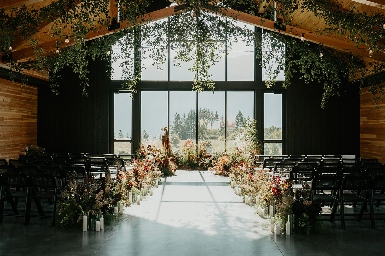 the inside of the indoor Wind Mountain Ranch wedding venue