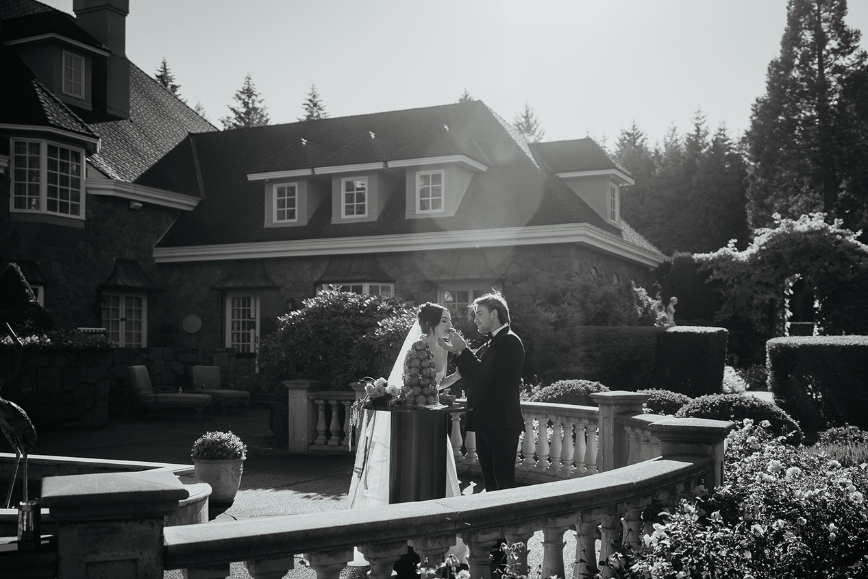 newlyweds hugging on a terrace at the Chateau de Michellia.