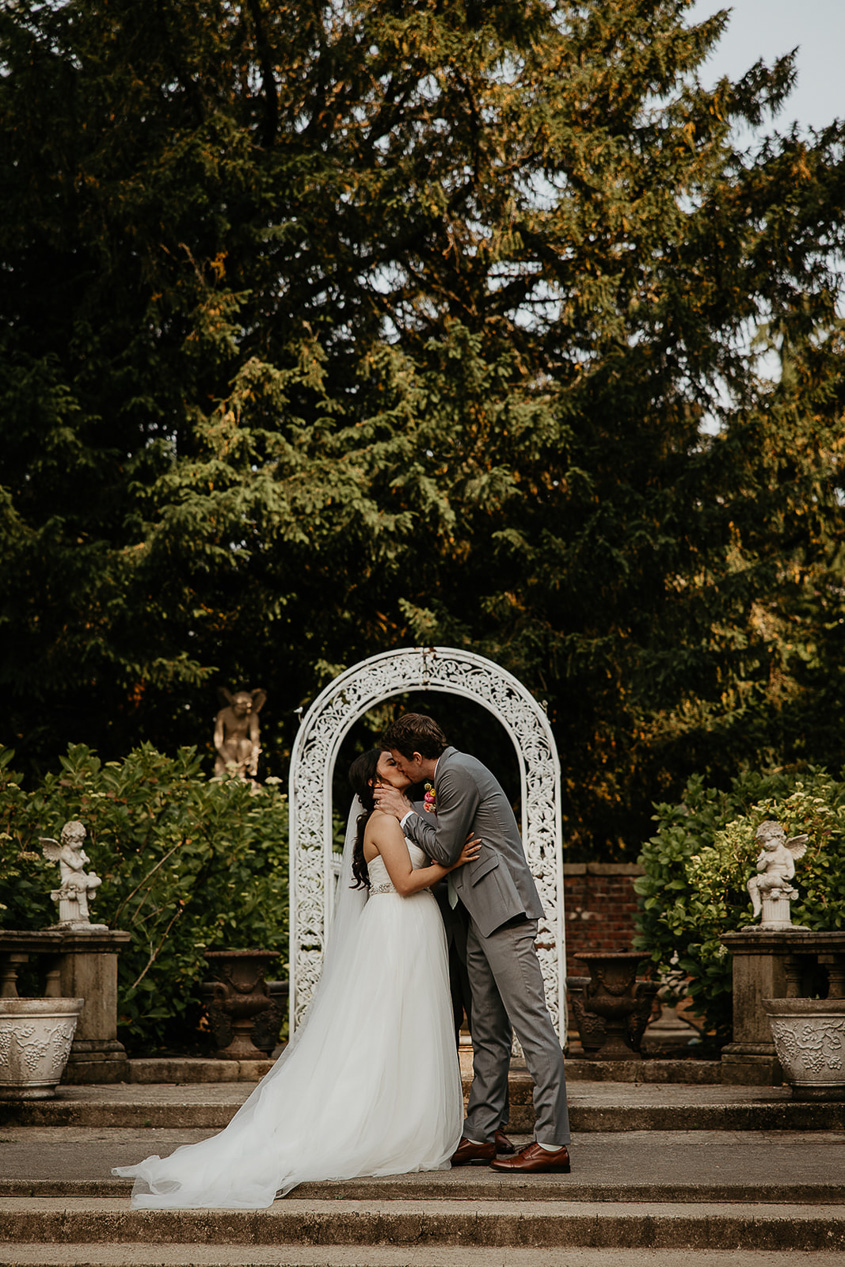 the bride and groom kissing after their ceremony.