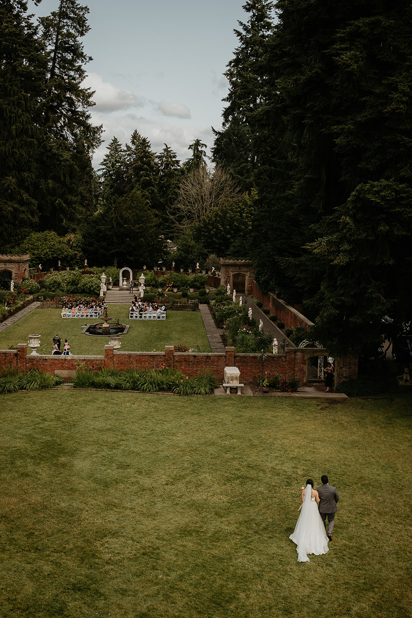 the bride walking toward her thornewood castle wedding ceremony.