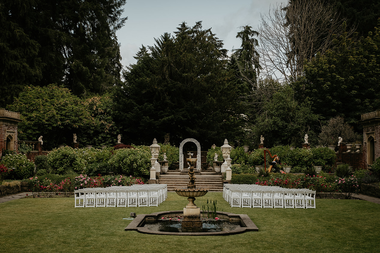 a fountain, chairs, and altar set up for a thornewood castle wedding.