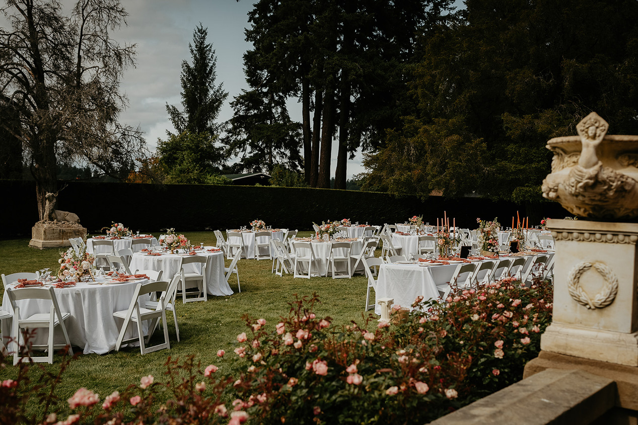 chairs and table set out on the lawn of the thornewood castle wedding venue.