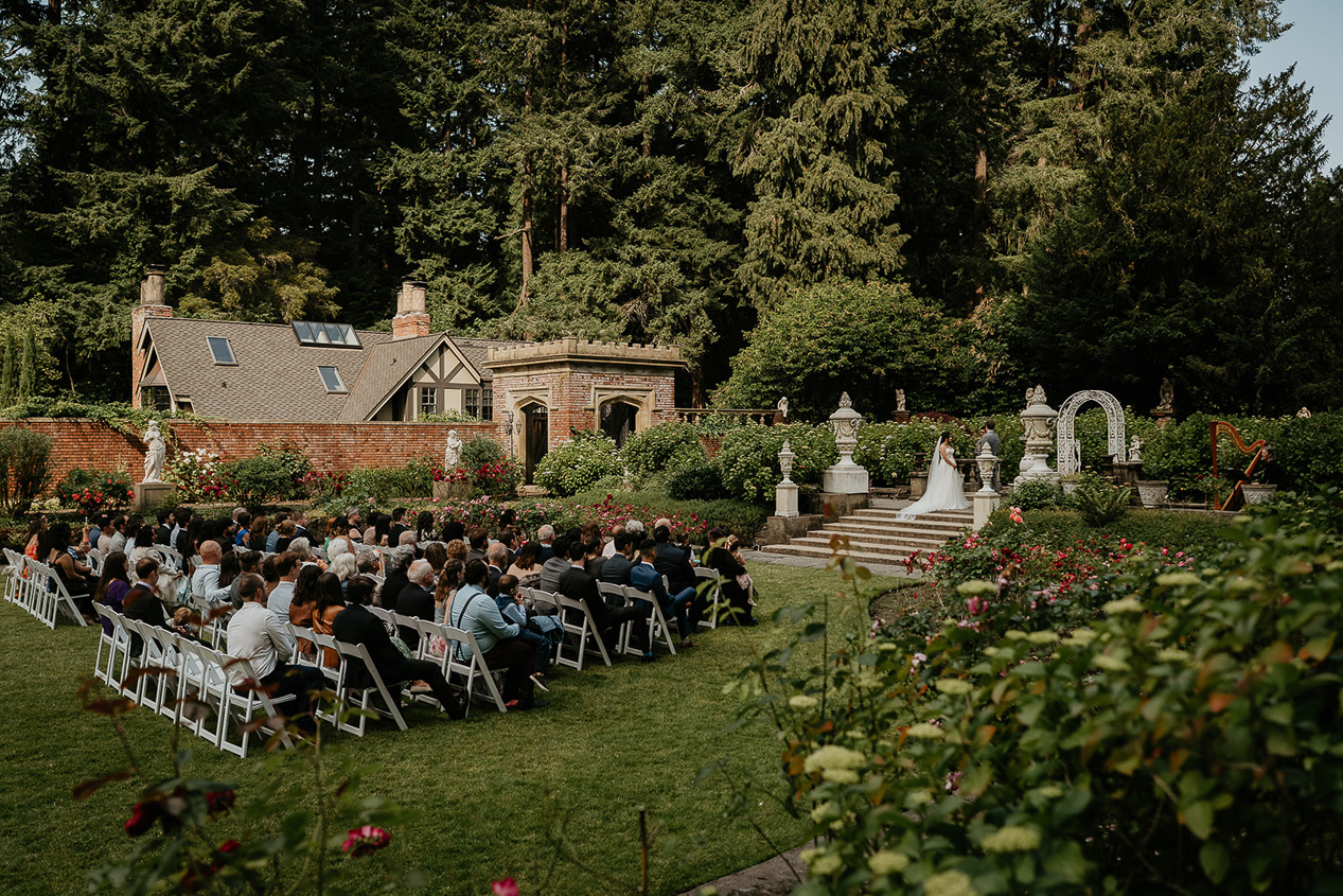 wedding guests watching the bride and groom get married during their thornewood castle wedding.