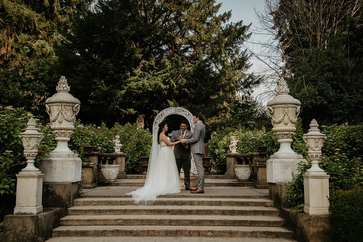 the bride and groom standing at the altar of their thornewood castle wedding.