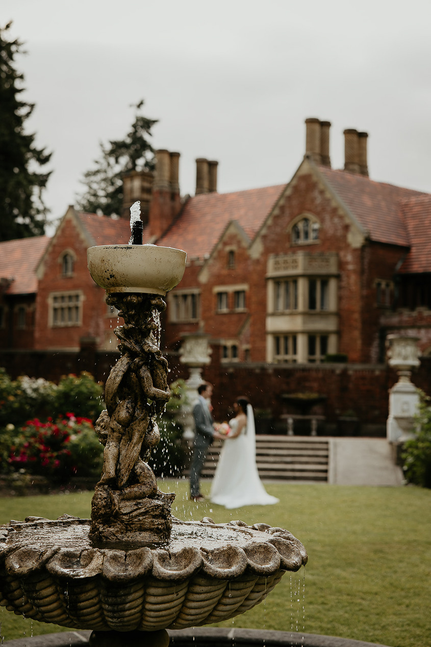 newlyweds dancing in front of the thornewood castle.