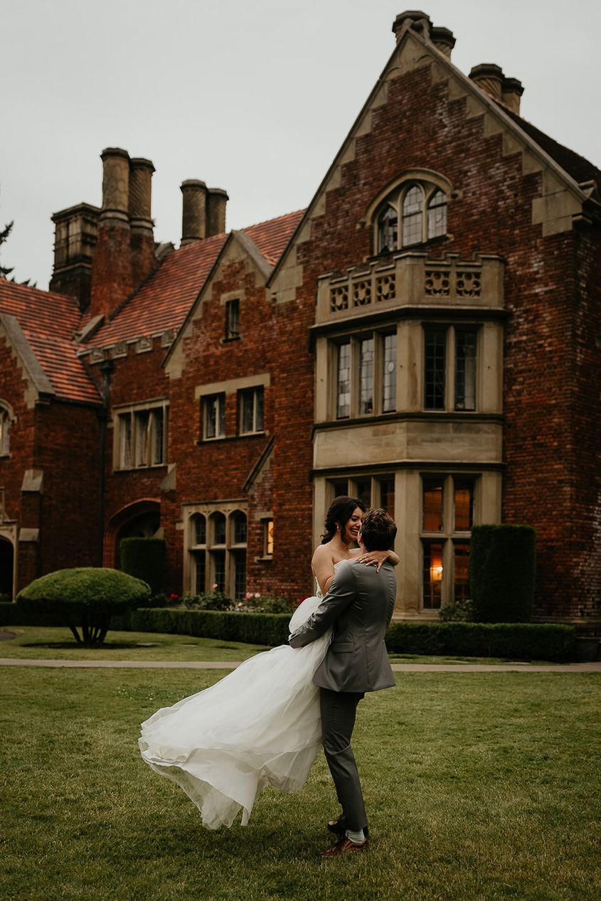 newlyweds dancing on the lawn outside thornewood castle wedding venue.