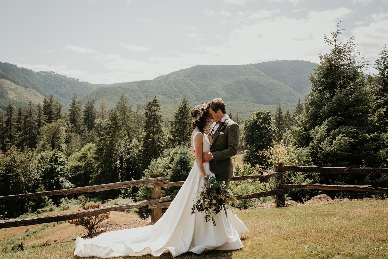 Bride and groom stand with their foreheads together after their rustic barn wedding first look at Rebers Riverside.