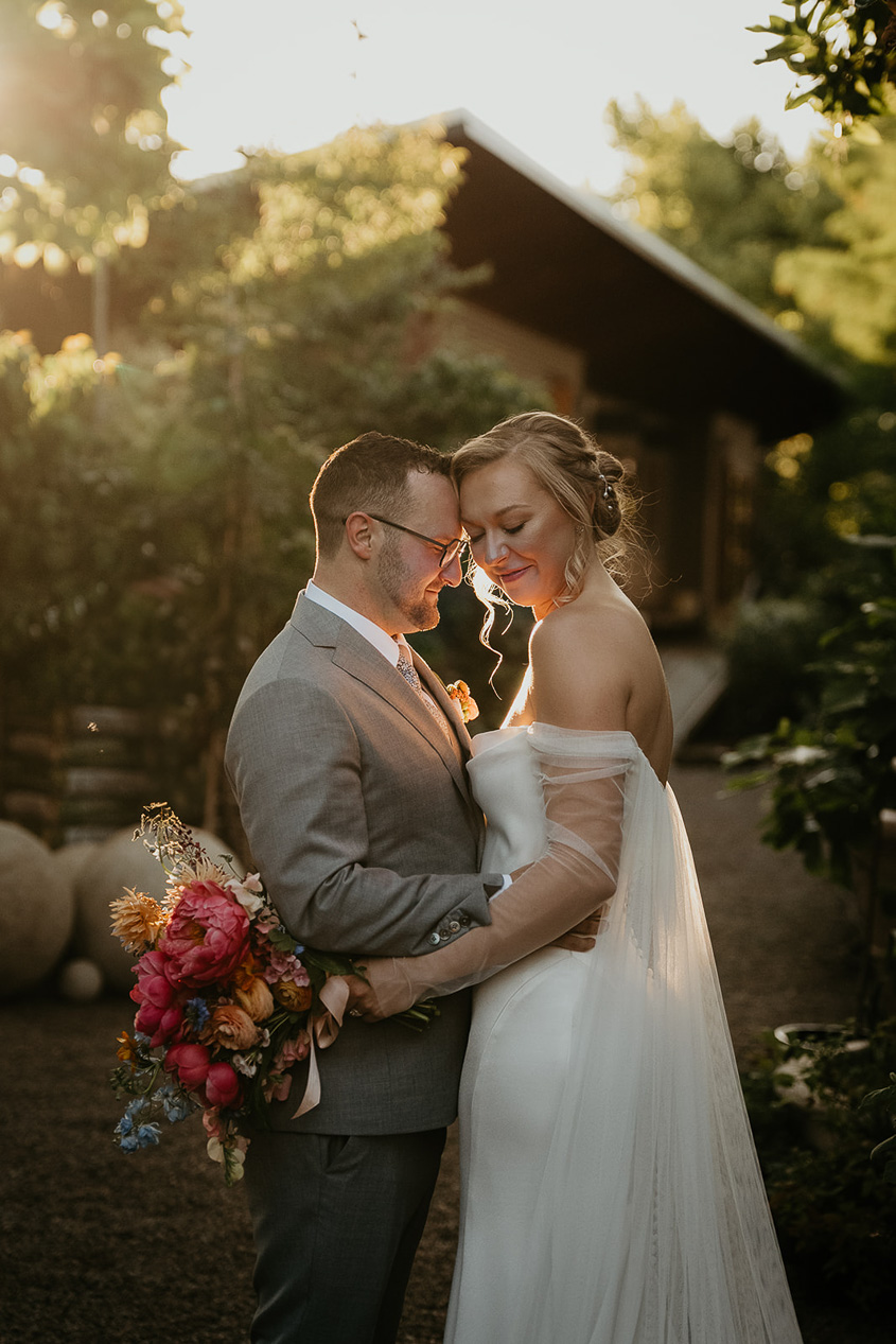 newlyweds hugging at Blockhouse PDX, one of the best wedding venues in Portland.