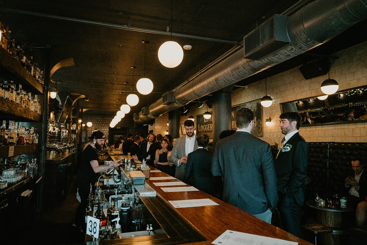 wedding guests inside Loyal Legion underneath The Evergreen, one of the best wedding venues in Portland.