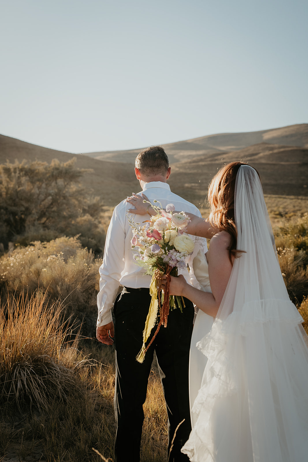 newlyweds sharing a first look in the desert.