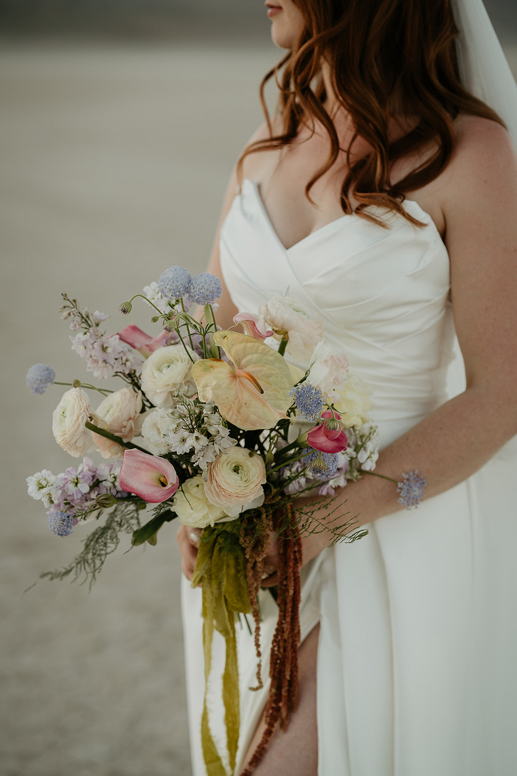 the bride holding a bouquet of flowers.
