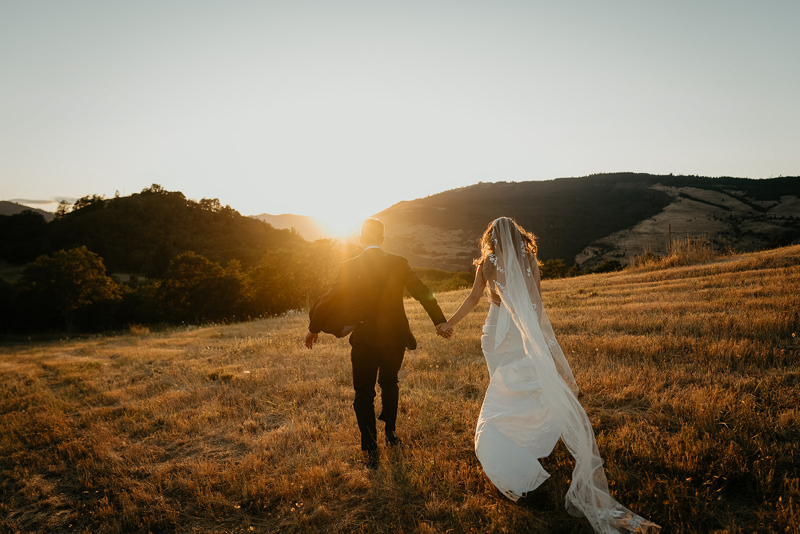 newlyweds running into the sunset.