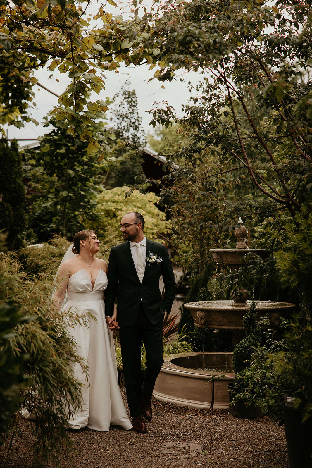 newlyweds exploring a garden.
