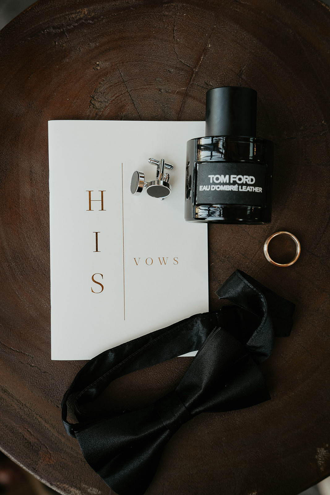 a tie, wedding ring, Tom Ford cologne, and his vows.