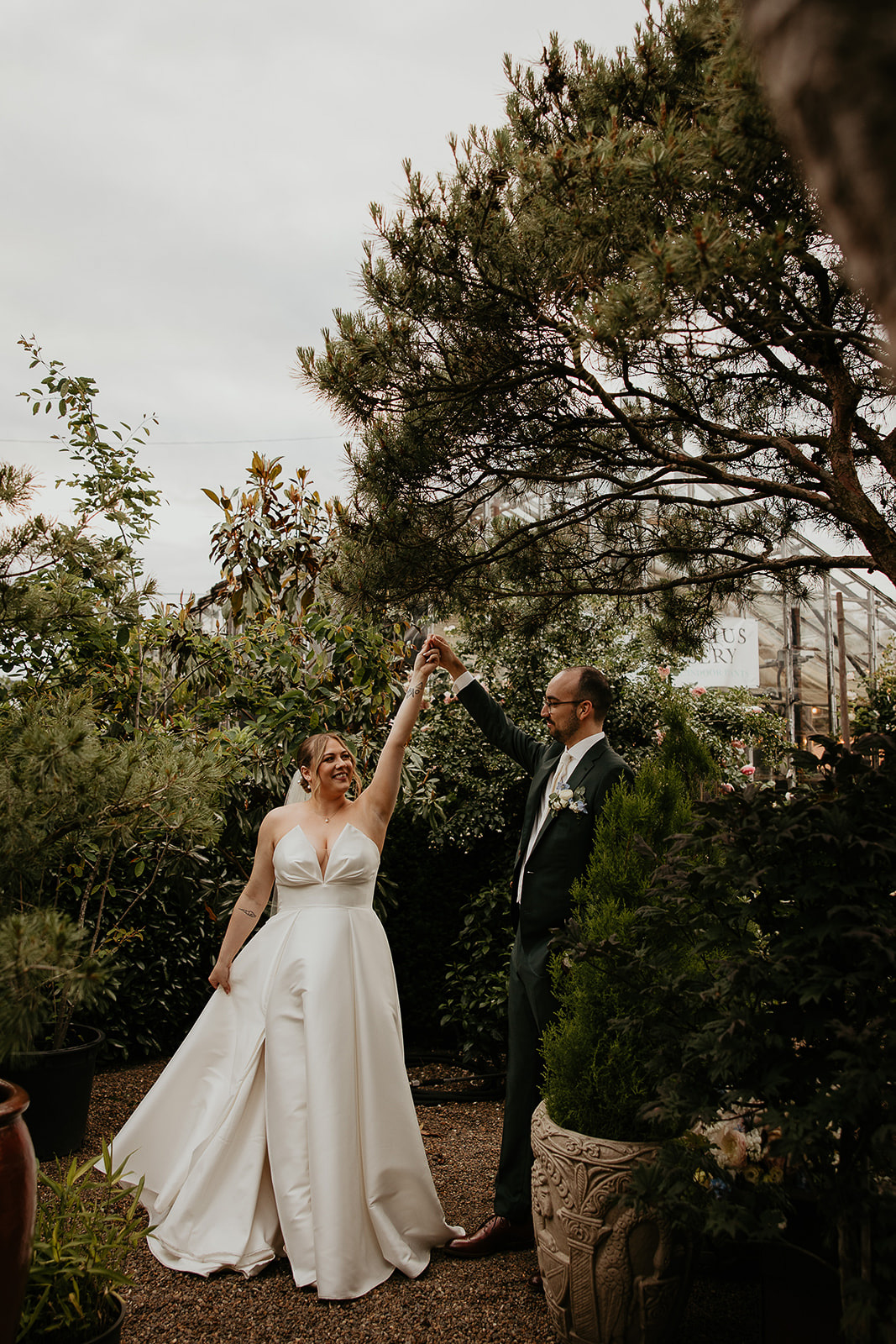 newlyweds dancing inside a nursery.