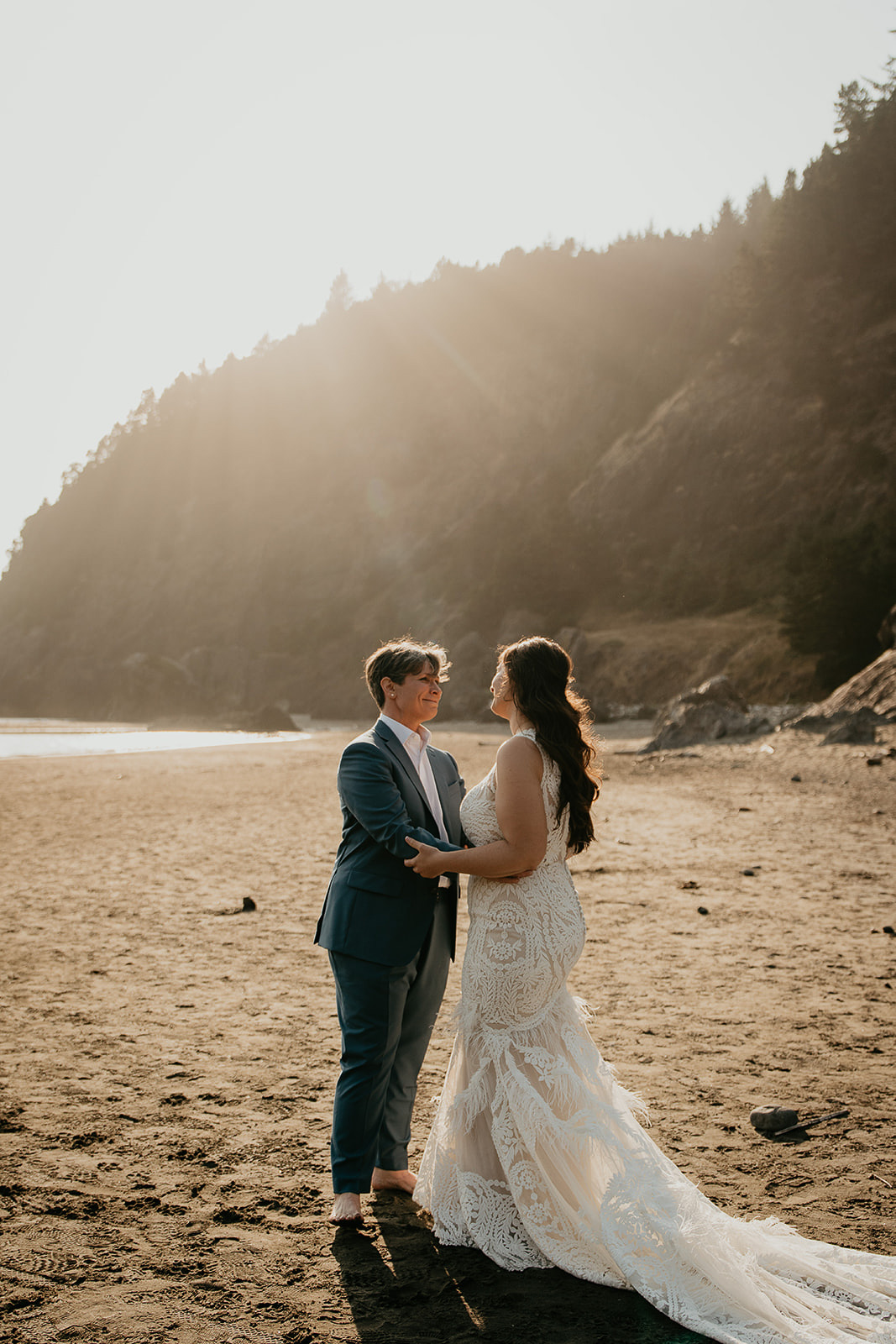 newlyweds hugging on the southern Oregon Coast.