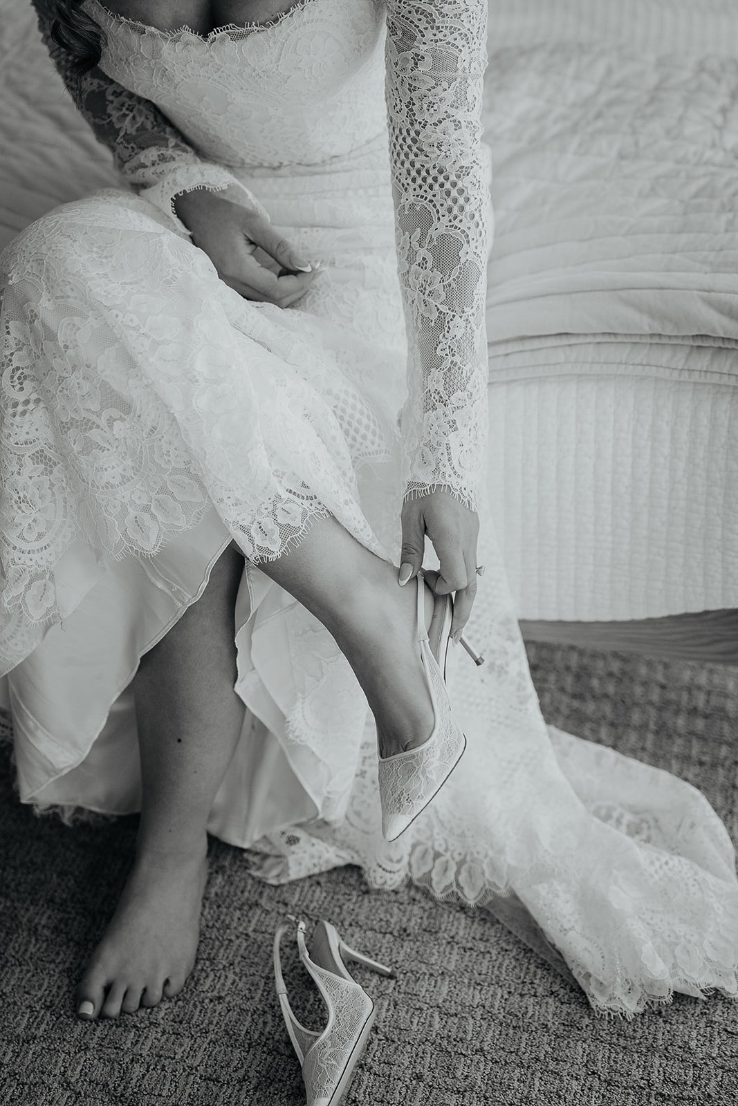 a bride putting on a heel before her rocky hill oregon wedding.