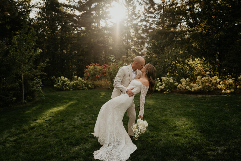 newlyweds kissing at sunset during their Rocky Hill Oregon wedding.