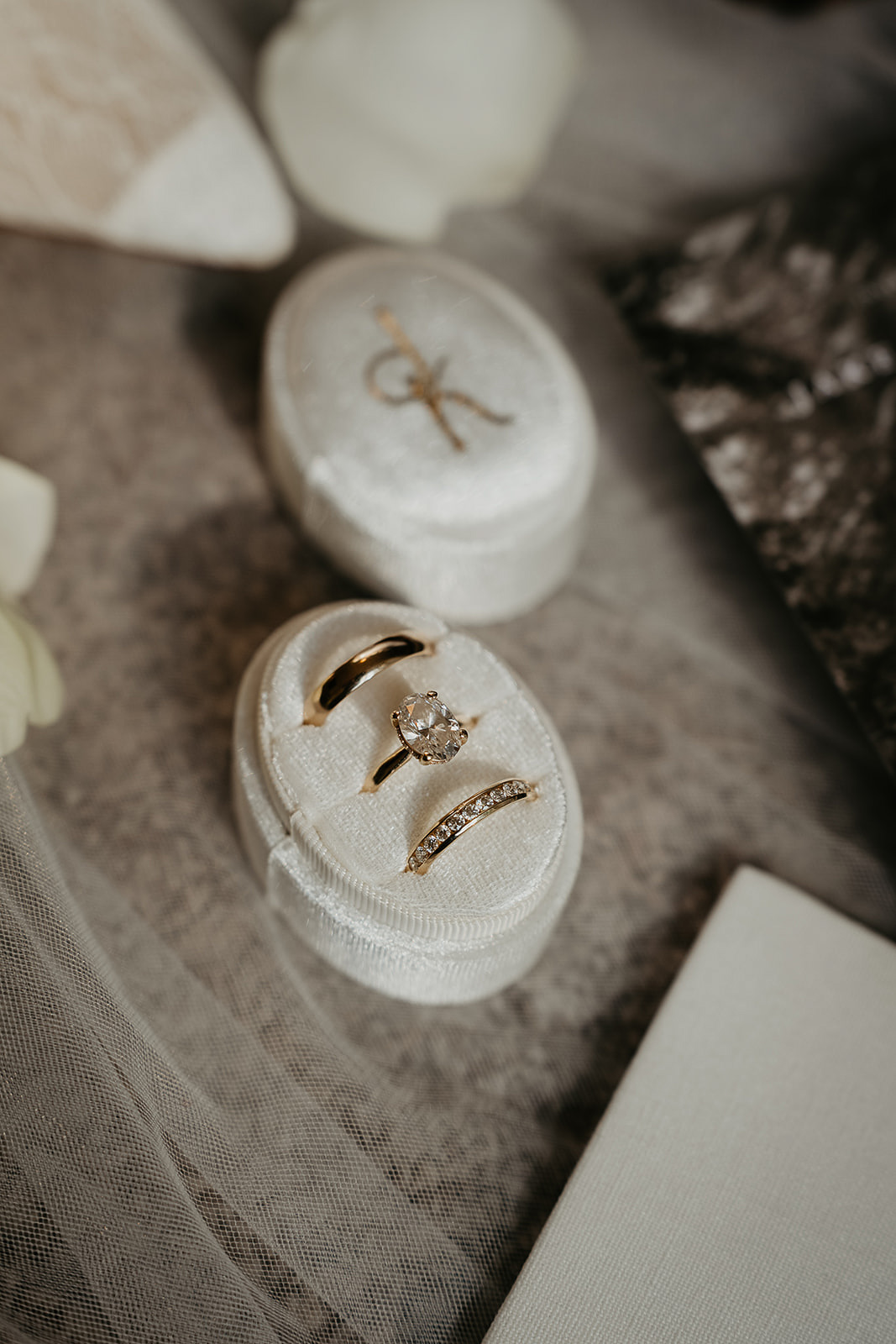 wedding rings inside of a ring holder.