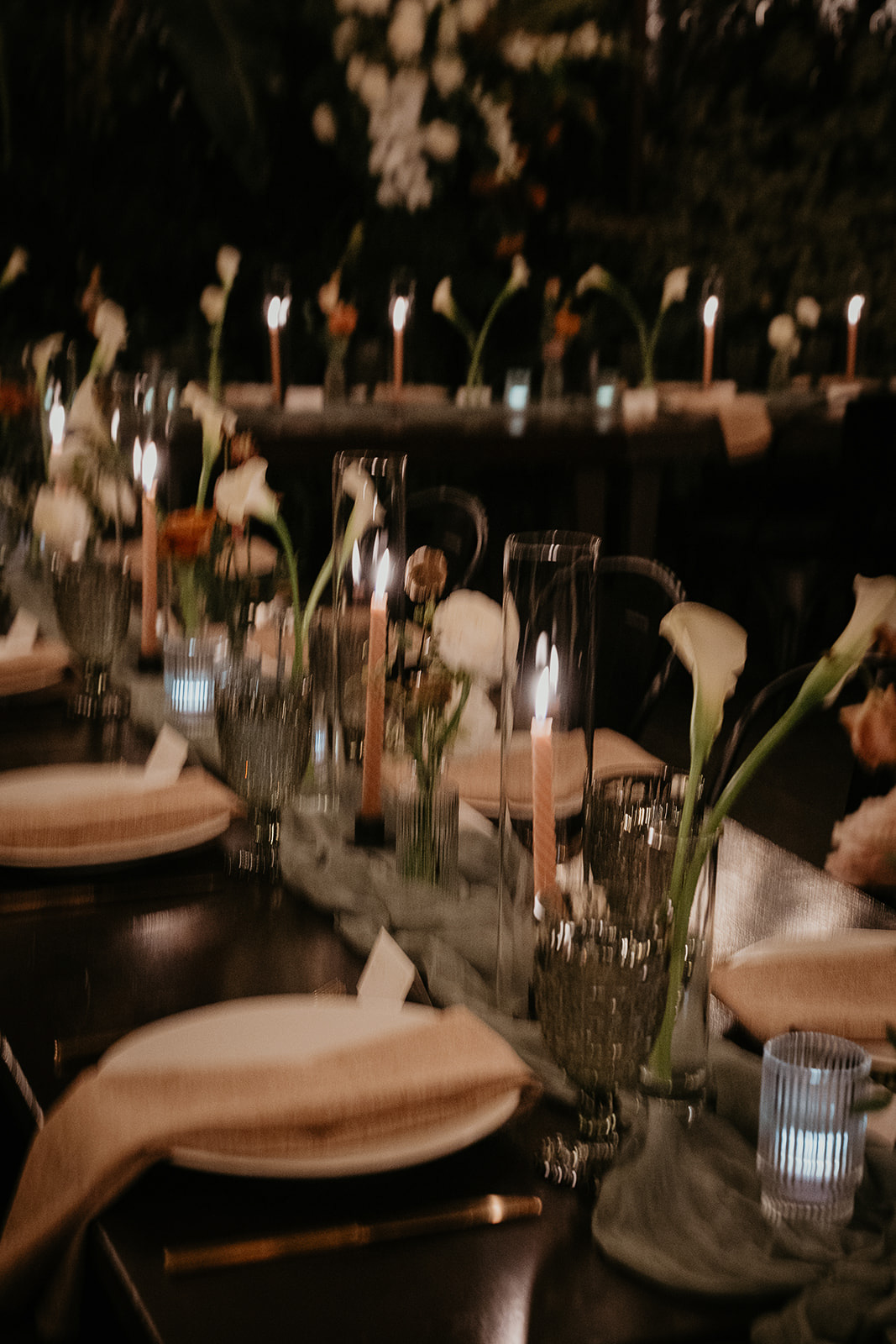 table settings, candles, flowers on a wedding dining table.