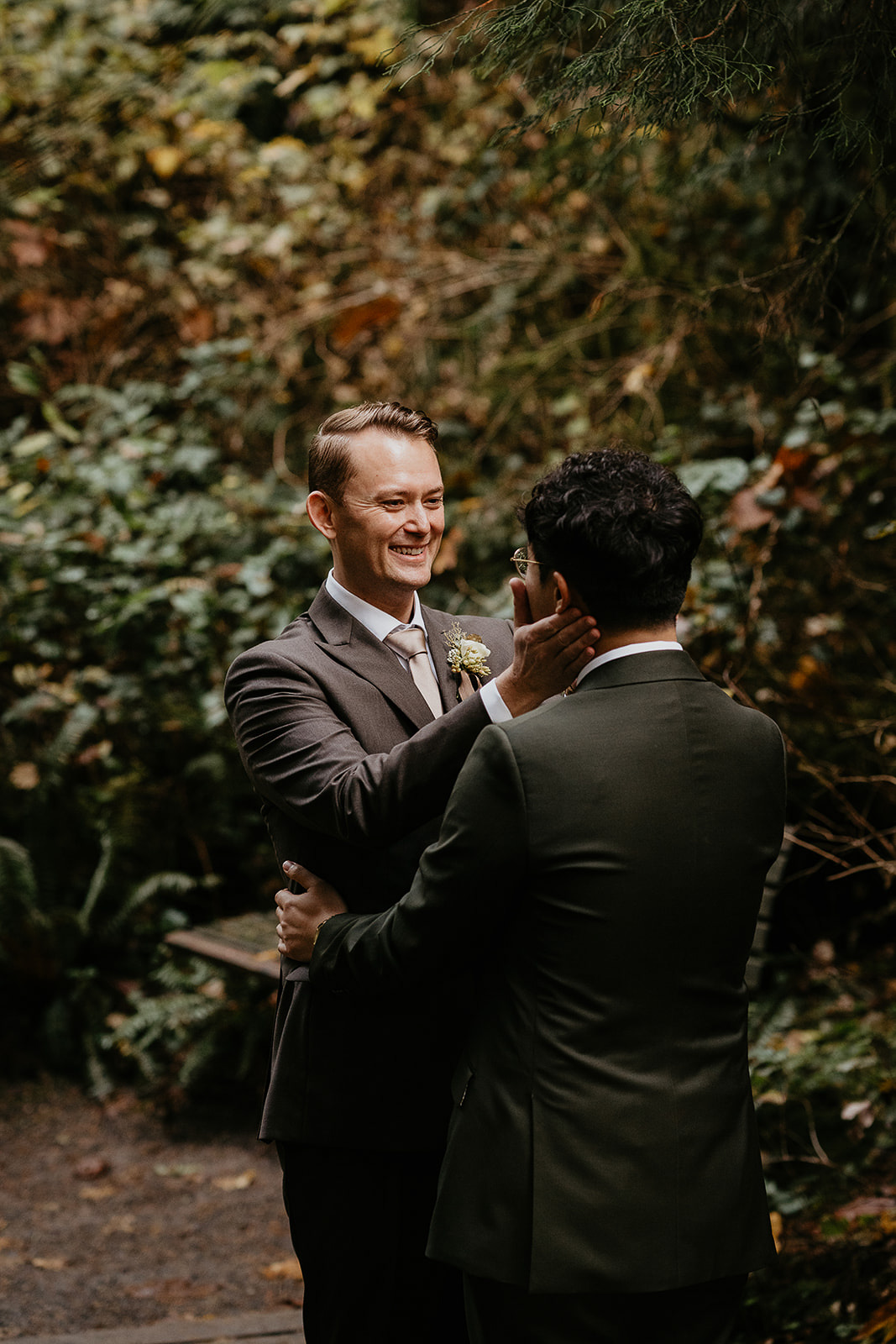 newlyweds hugging in the forest.