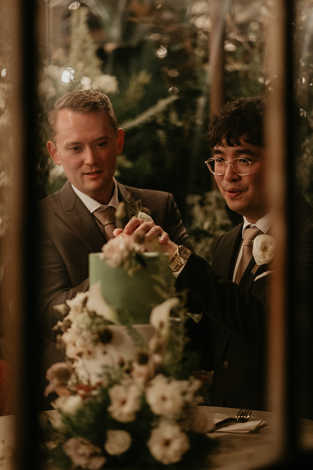 newlyweds cutting their cake during their forest elopement in Oregon.