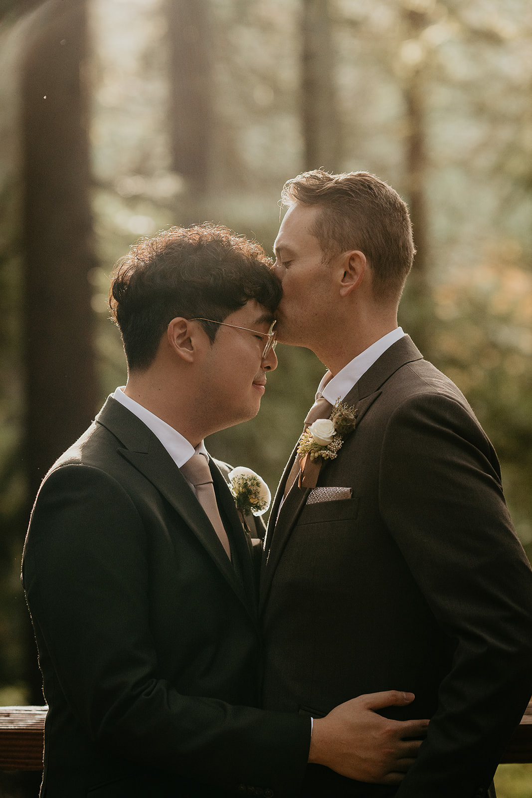 newlyweds hugging in a forest.