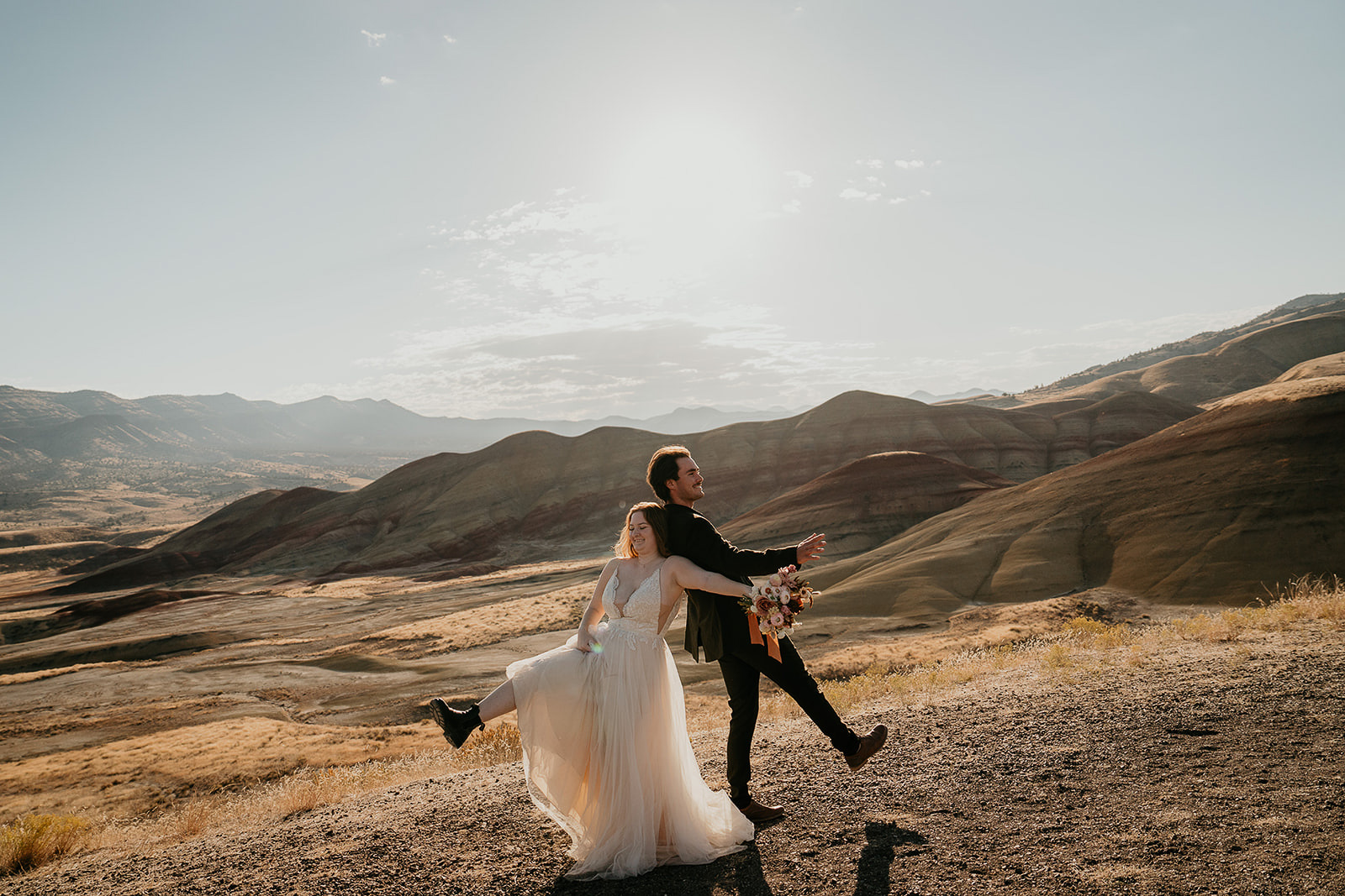 newlyweds celebrating as they elope at sunrise.