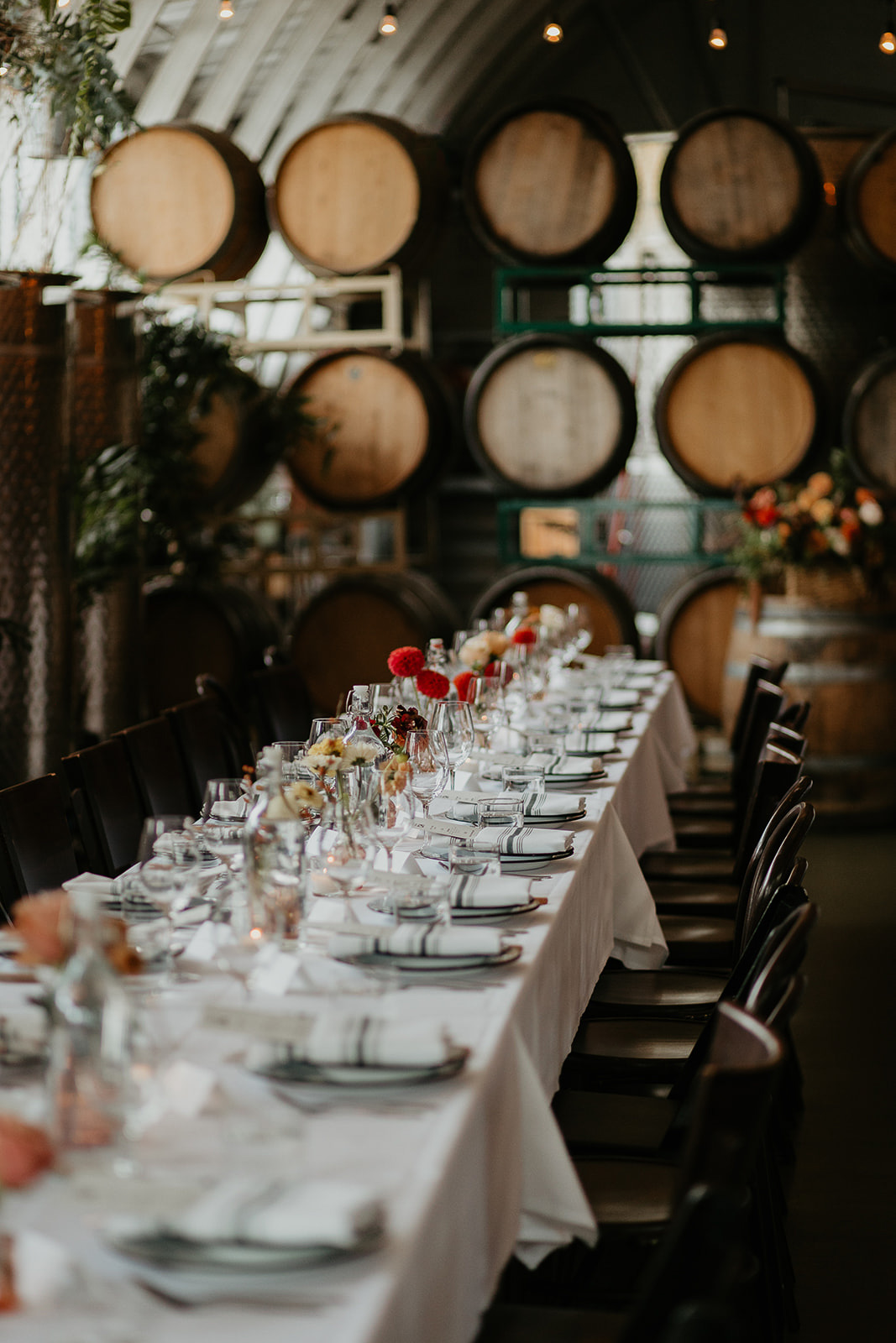 wedding table settings, including plates and flowers.