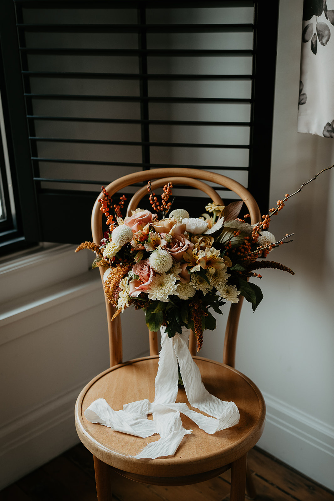 flowers sitting on a chair.